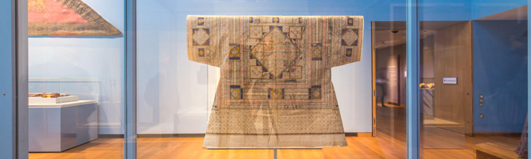 Garment in case as part of museum exhibition